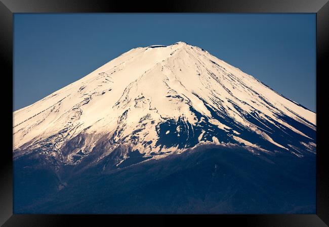 Snow capped peak of Mt. Fuji, symbol of Japan Framed Print by Mirko Kuzmanovic