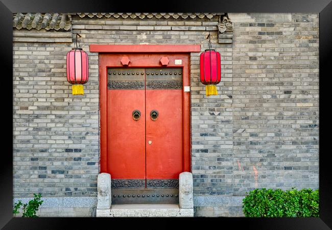 Traditional Hutong alley in Beijing, China, Vintage door with red lanterns Framed Print by Mirko Kuzmanovic