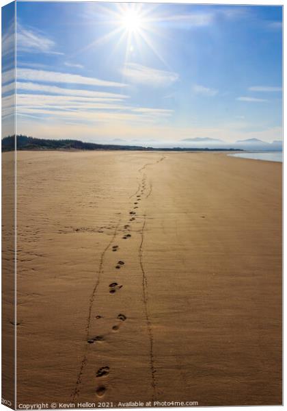 Footprints in the sand  Canvas Print by Kevin Hellon