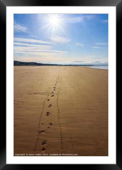 Footprints in the sand  Framed Mounted Print by Kevin Hellon