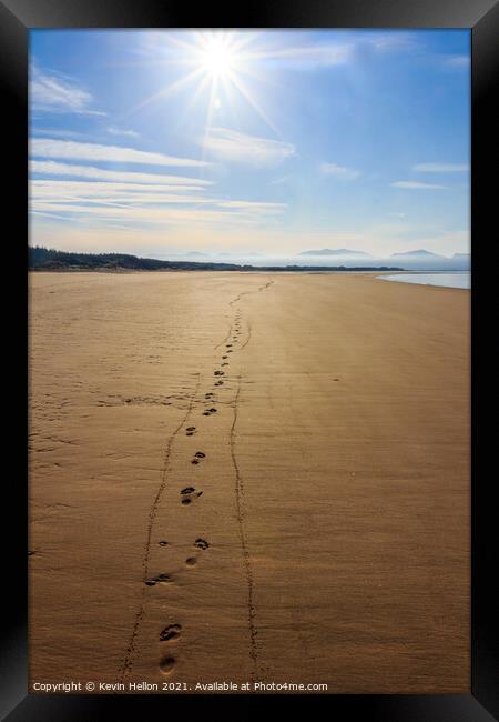 Footprints in the sand  Framed Print by Kevin Hellon