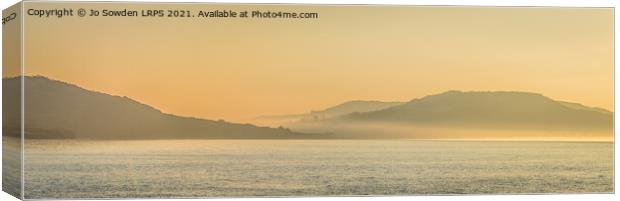 Early morning mist over Charmouth Canvas Print by Jo Sowden