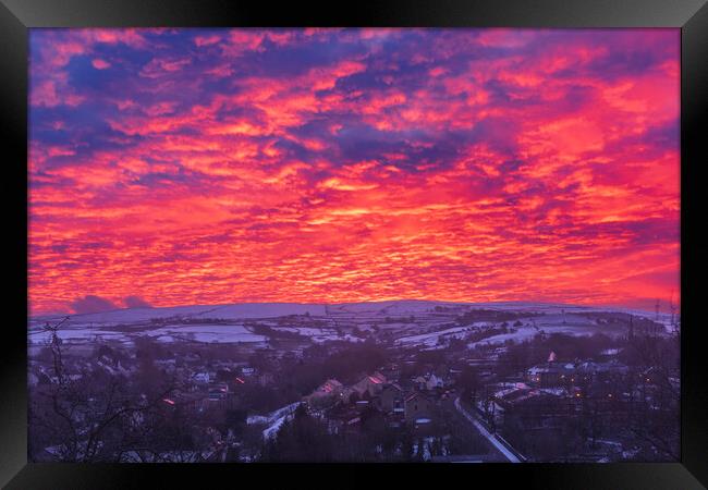 Winter dawn sky over New Mills, Derbyshire Framed Print by John Finney