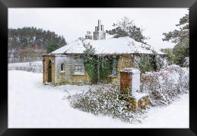 Snow covered abandoned cottage Framed Print by David Hare