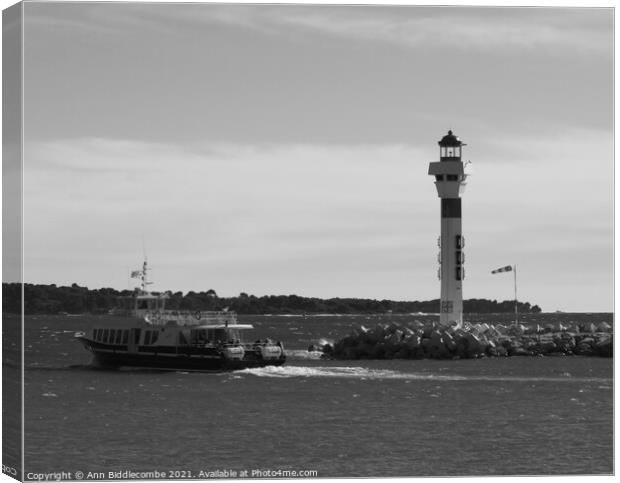 Ferry and lighthouse in monochrome Canvas Print by Ann Biddlecombe