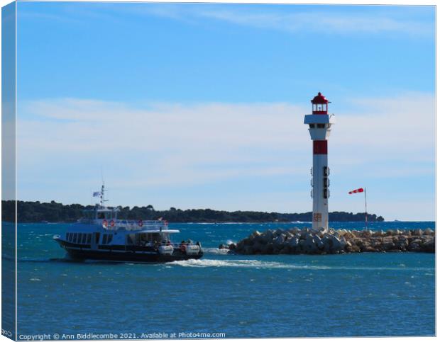 Ferry and lighthouse in cannes Canvas Print by Ann Biddlecombe