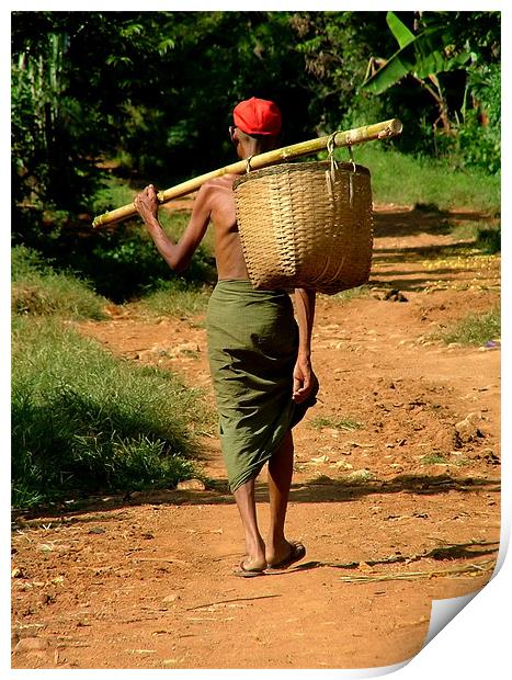 Man in Lungi Walking with Basket, Myanmar (Burma) Print by Serena Bowles