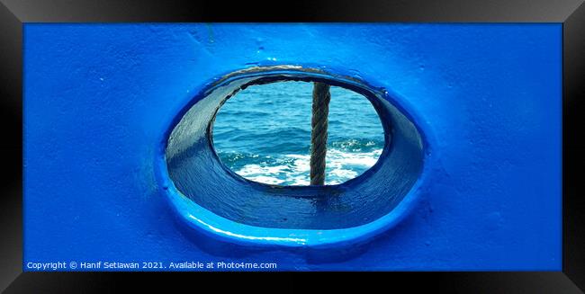Bull´s eye in a blue iron wall from a ship. 1b Framed Print by Hanif Setiawan