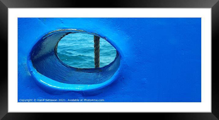 Bull´s eye in a blue iron wall from a ship. 2b Framed Mounted Print by Hanif Setiawan