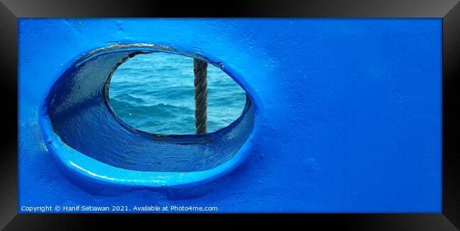Bull´s eye in a blue iron wall from a ship. 2b Framed Print by Hanif Setiawan