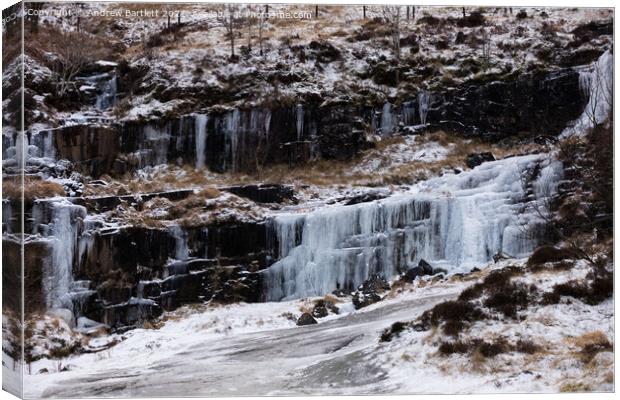 Frozen waterfall at the Brecon Beacons, South Wales, UK. Canvas Print by Andrew Bartlett