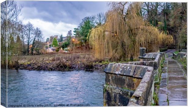 Stone bridge over a raging River Wye, Bakewell Canvas Print by Chris Yaxley