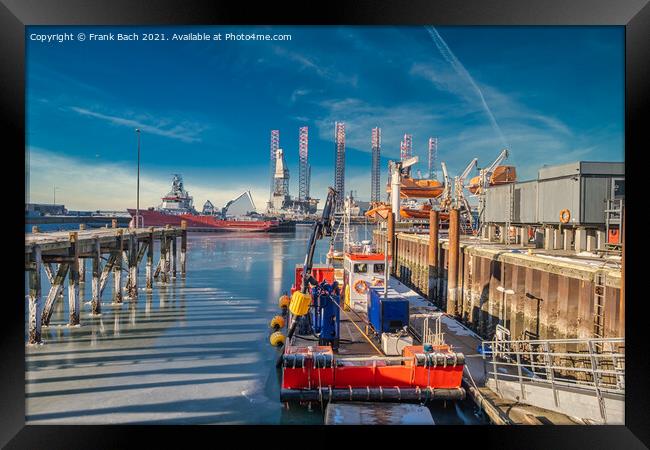 Wind power rigs in Esbjerg harbor. Denmark Framed Print by Frank Bach