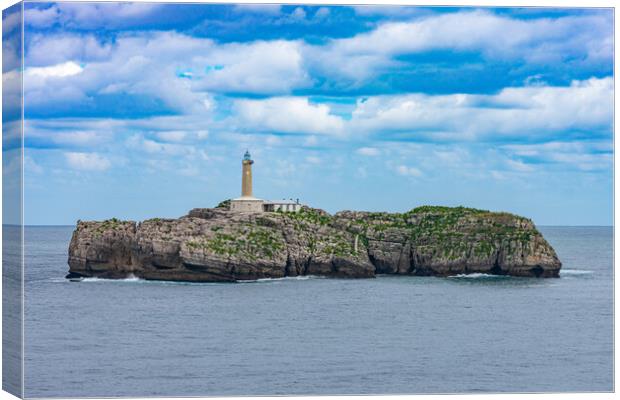 close view of a rock islet in the sea with a lighthouse Canvas Print by David Galindo