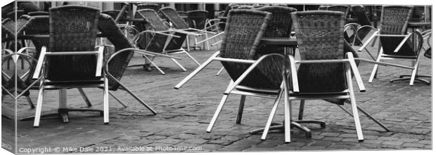 Stacked chairs Canvas Print by Mike Dale