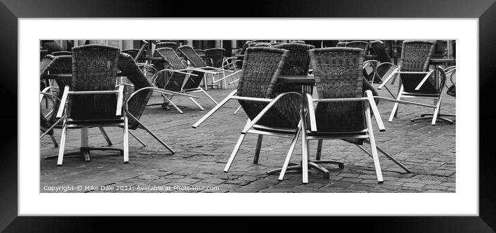 Stacked chairs Framed Mounted Print by Mike Dale