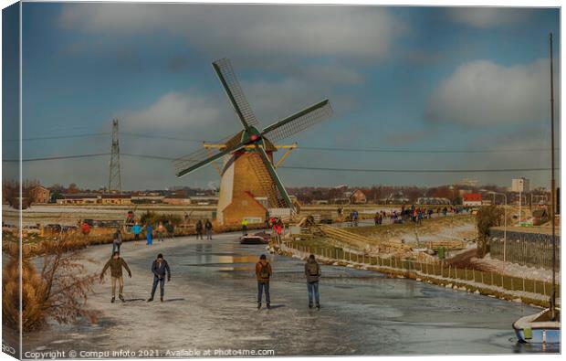 People skating om ice with windmill as background Canvas Print by Chris Willemsen