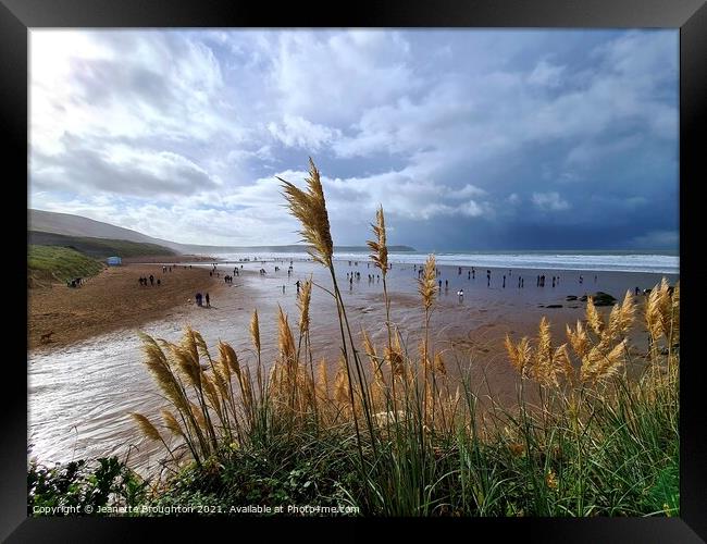 Storm over Woolacombe beach Framed Print by Jeanette Broughton