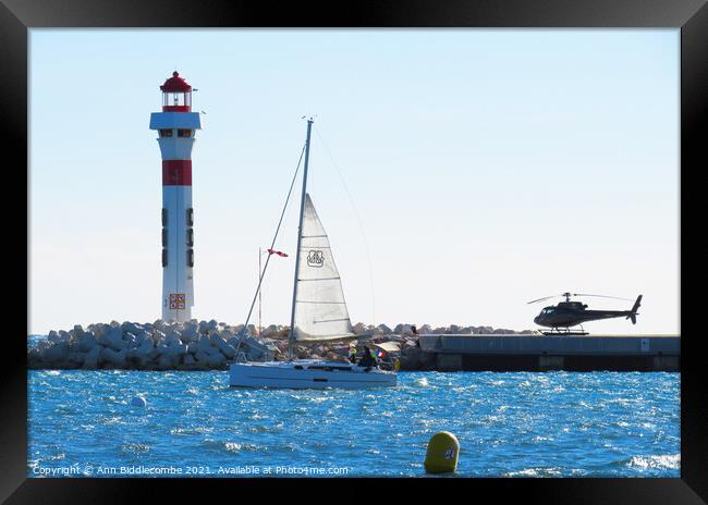 Lighthouse, Yacht and Helicopter in Cannes Framed Print by Ann Biddlecombe