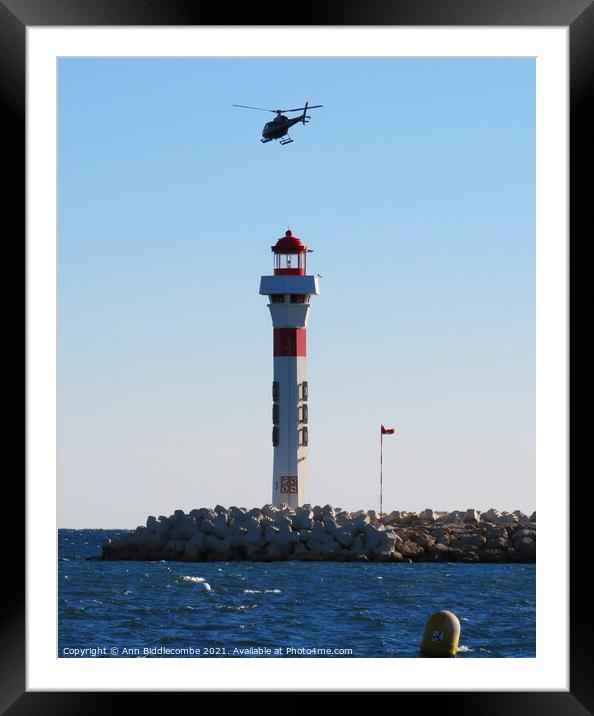 Helicopter above the Lighthouse Framed Mounted Print by Ann Biddlecombe