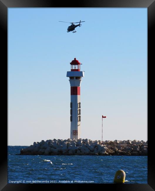 Helicopter above the Lighthouse Framed Print by Ann Biddlecombe