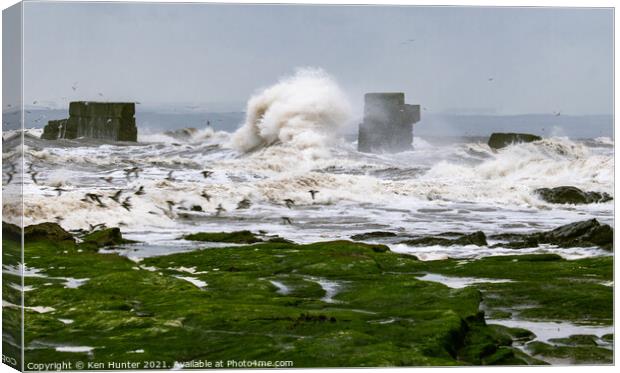 Old Sea Wall Braving Towering Wave  Canvas Print by Ken Hunter