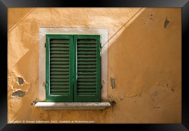 Green shutters and a yellow concrete wall in Italy Framed Print by Steven Dijkshoorn