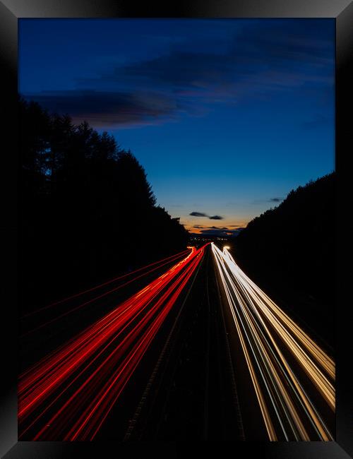 Motorway Light Trails. Framed Print by Tommy Dickson
