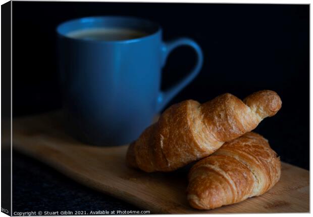 A cup of coffee with croissants for breakfast Canvas Print by Stuart Giblin
