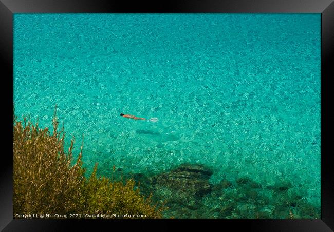 Swimming in the crystal clear sea, Halkidiki, Gree Framed Print by Nic Croad
