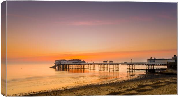Cromer pier at sunrise. Canvas Print by Bill Allsopp