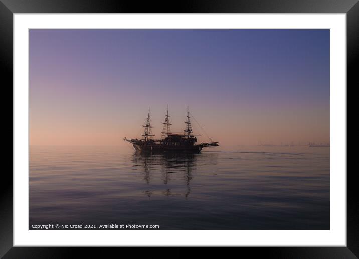 Ship on calm sea in Thessaloniki, Greece. Framed Mounted Print by Nic Croad