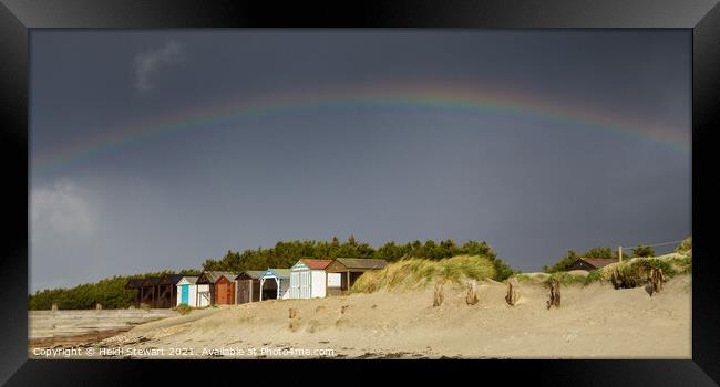 Rainbow and Beach Huts Framed Print by Heidi Stewart