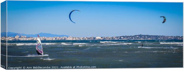  Windsurfers and Kite surfers  in Cannes Canvas Print by Ann Biddlecombe