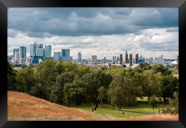 Canary Wharf tall buildings from Greenwich park Framed Print by tim miller