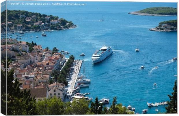 Liner docking at Hvar Harbour Canvas Print by Adrian Beese
