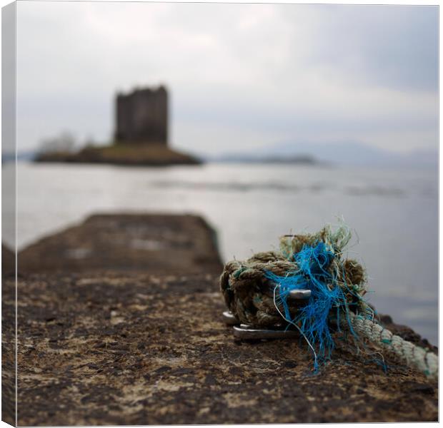 Knotted rope on jetty at Castle Stalker. Canvas Print by Tommy Dickson