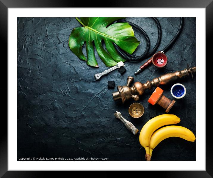 Smoking hookah with banana tobacco Framed Mounted Print by Mykola Lunov Mykola