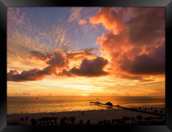 Fiery hues over Pier 60, Clearwater.  Framed Print by Tommy Dickson
