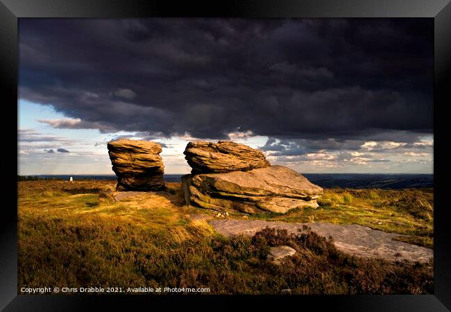The Ox Stones caught in storm light Framed Print by Chris Drabble