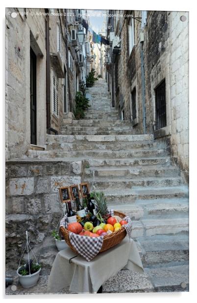 Basket of wine and fruit in Dubrovnik Acrylic by Adrian Beese