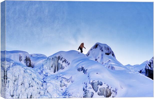 The figure of a person on the top of the frozen Chutes de Chaudière at Charny near Quebec City, Canada Canvas Print by Colin Woods