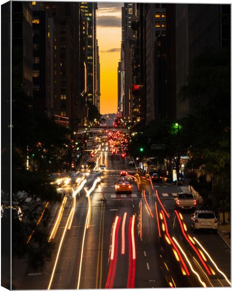 Manhattanhenge when the sun sets along 42nd street in NY Canvas Print by Steve Heap