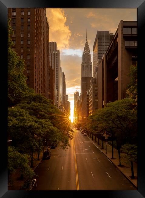 Manhattanhenge when the sun sets along 42nd street in NY Framed Print by Steve Heap