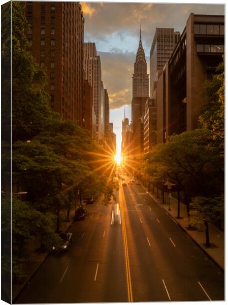 Manhattanhenge when the sun sets along 42nd street in NY Canvas Print by Steve Heap