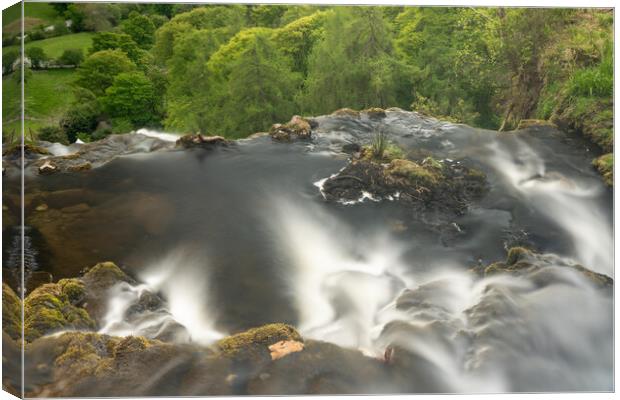 Blurred motion stream falls from top of waterfall of Pistyll Rha Canvas Print by Steve Heap