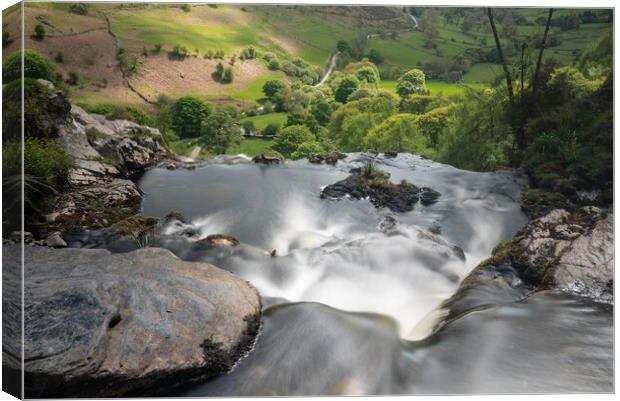 Blurred motion stream falls from top of waterfall of Pistyll Rha Canvas Print by Steve Heap