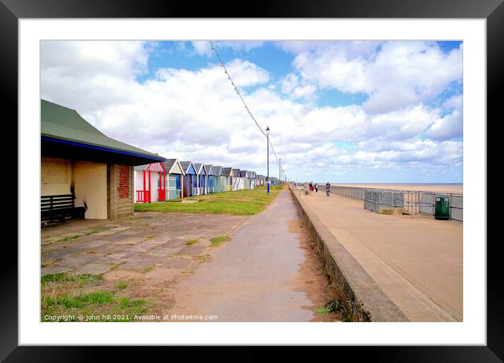 Promenade and beach huts. Framed Mounted Print by john hill