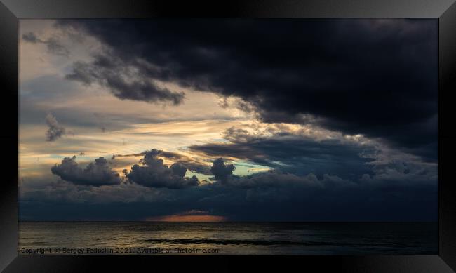 Coast of a sea and dramatic sky. Evening time. Stormy weather. Framed Print by Sergey Fedoskin