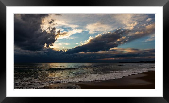 Coast of a sea and dramatic sky. Evening time.  Framed Mounted Print by Sergey Fedoskin